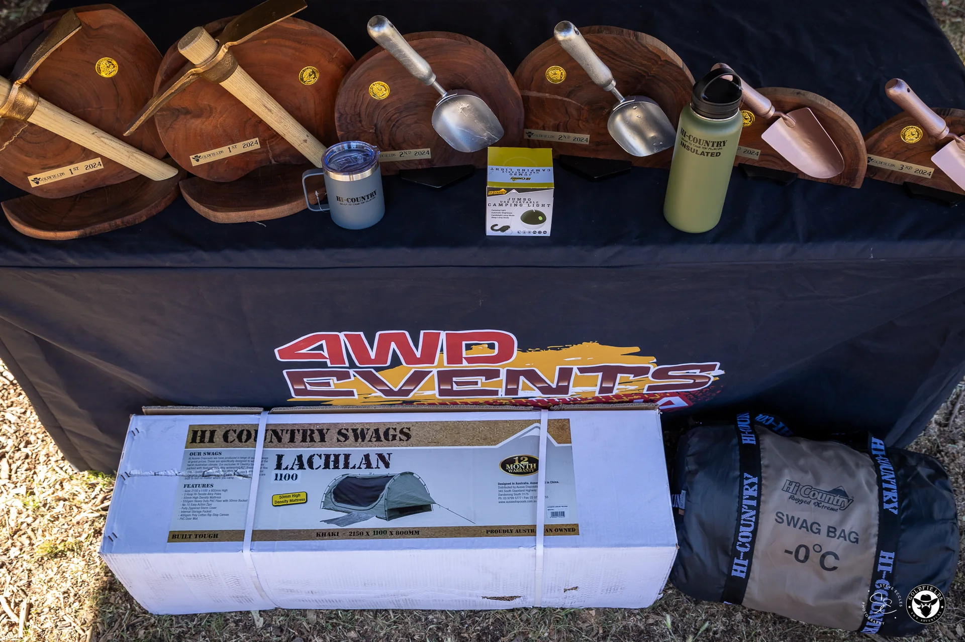 Prize table at Amazing Race Goldfields — Hi Country swag and trophies