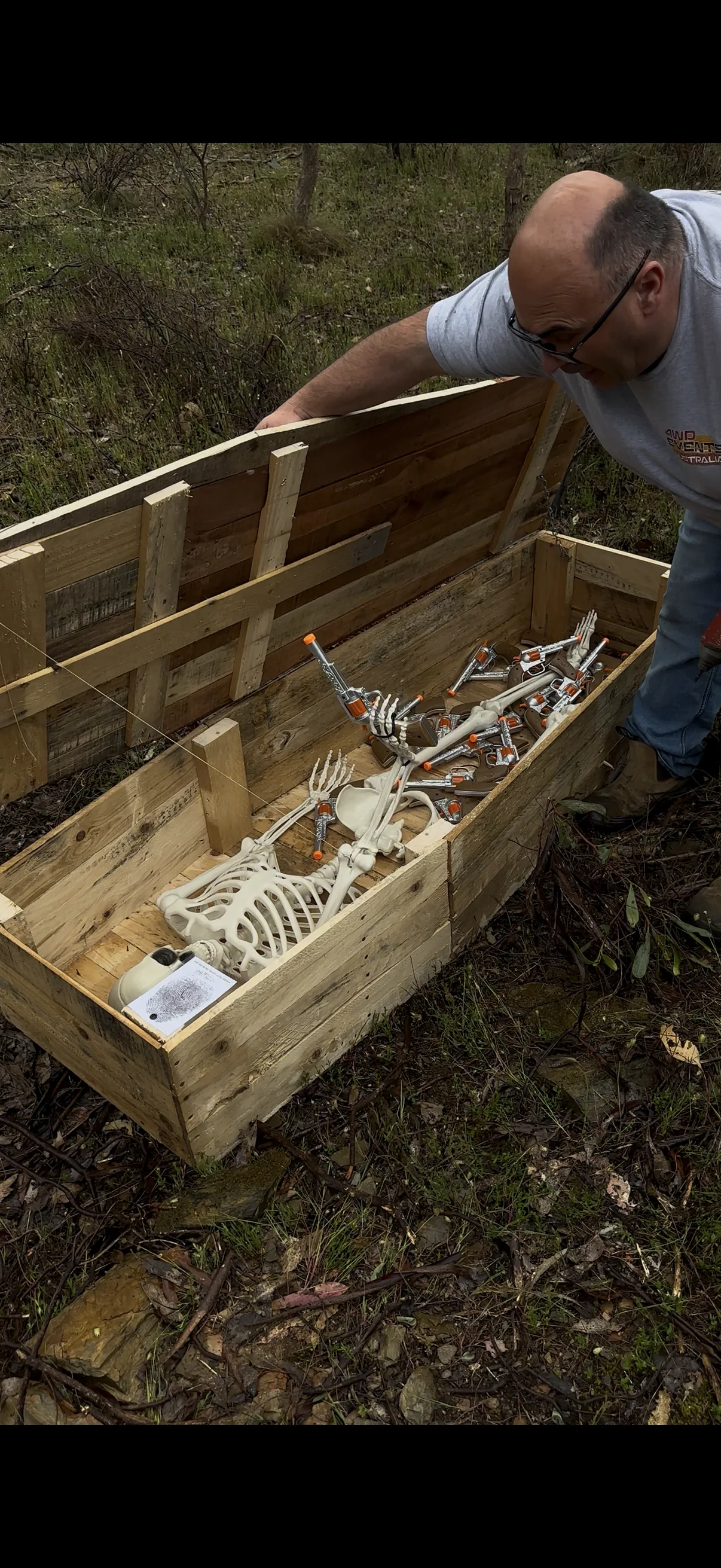 Hand-built coffin with skeleton, revolvers and fingerprint card — found in the Goldfields bush