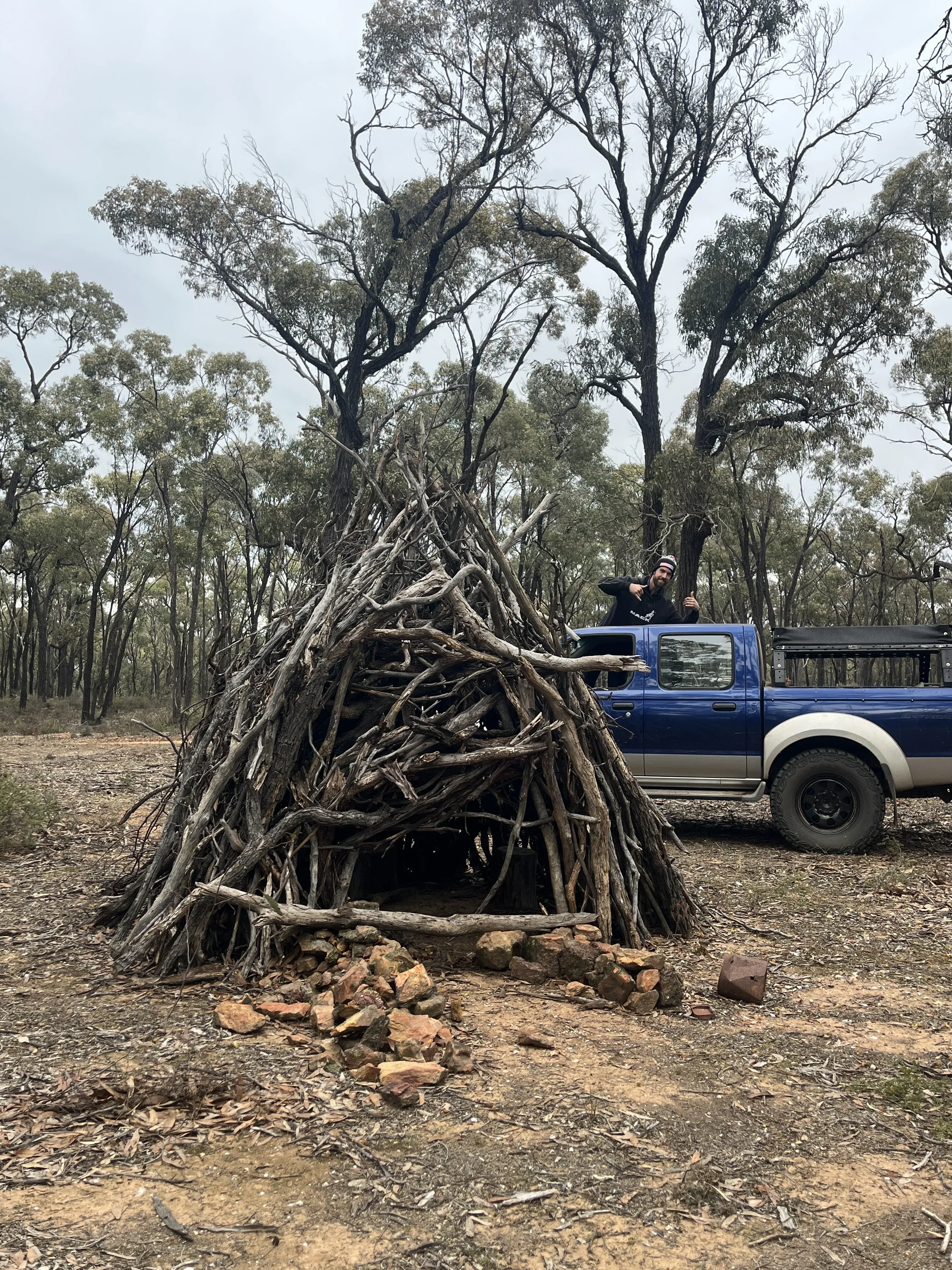 Team replication — stick shelter with bloke out the sunroof